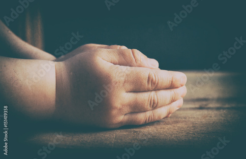 Child hands folded for prayer photo