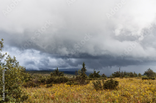 Ural mountains  bad weather  approaching thunderstorm  storm  field with stones. sunset colors  beautiful sky
