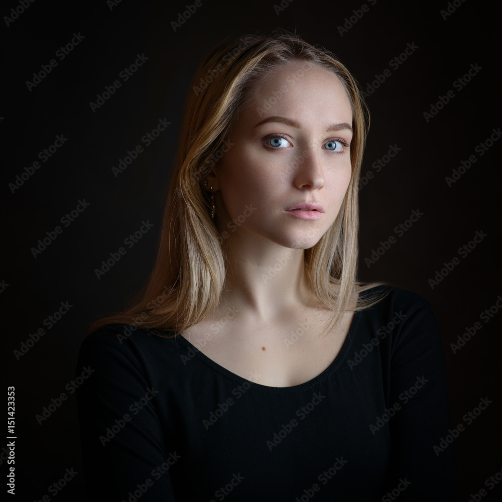 Portrait of a beautiful young woman with blue eyes. Portrait of a beautiful young woman with blue eyes.