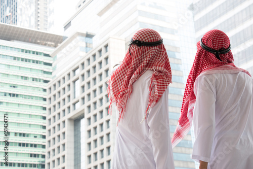 Photography Two Arabian business man are talking together