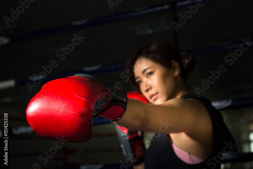 female boxer punch to the target in gym, boxing sport