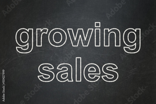 Finance concept  Growing Sales on chalkboard background