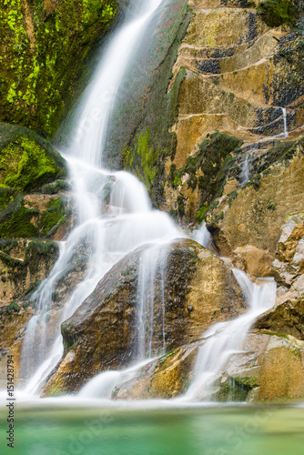Fototapeta Naklejka Na Ścianę i Meble -  Emerald Water of the Torre Torrent Falls. Silk water. Tarcento, Friuli to discover