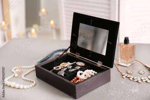 Jewelry and box on table
