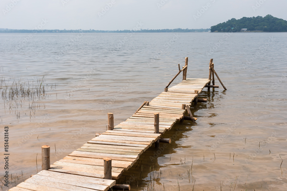 Fototapeta premium Summer time at the wooden pier in a lake