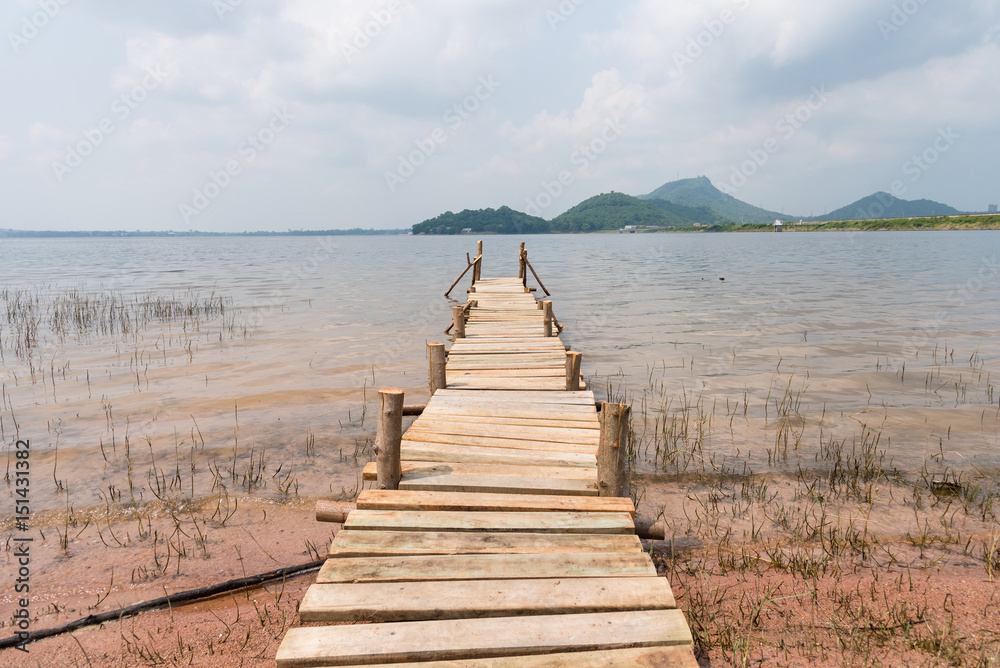 Fototapeta premium Summer time at the wooden pier in a lake