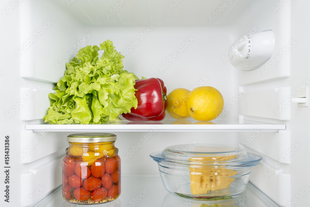 Open fridge full of fresh fruits and vegetables Open fridge full of fresh fruits and vegetables