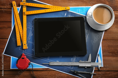 Tablet with blueprints and ...