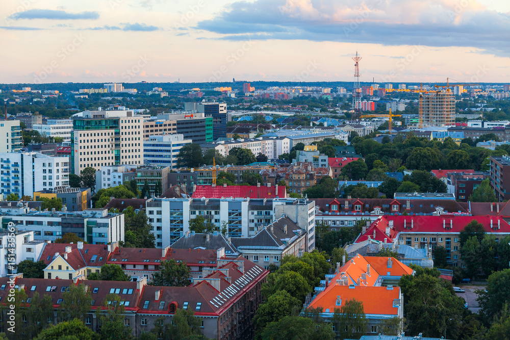 Obraz premium TALLINN, ESTONIA - JULY 29, 2016: Modern business buildings, living blocks and malls at sunset