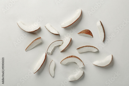 Coconut pieces on white background