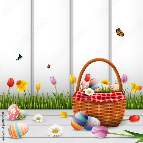 Happy easter with eggs and flowers on wood background
