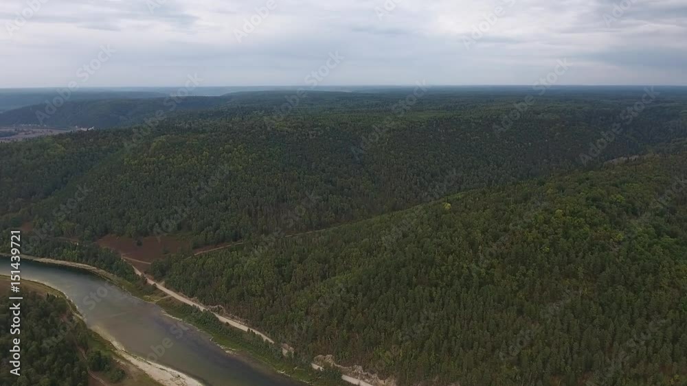 Aerial shot of mountains covered with coniferous forest with River. Aerial shot of mountains covered with coniferous forest with River.