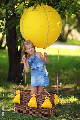 Girl playing with balloon