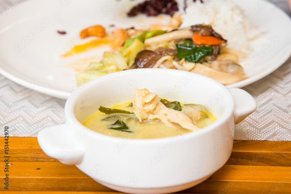 Green curry in white cup, Fried Vegetables and rice in a white dish for breakfast. Green curry in white cup, Fried Vegetables and rice in a white dish for breakfast.