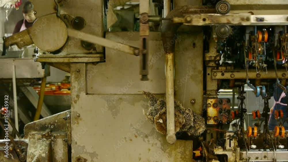 Reeling machine and Textile machine in operation. Reeling machine and Textile machine in operation.