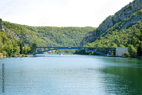 A bridge is connecting a part of an island so that cars can drive from one side to another easily.