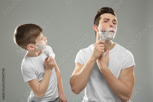 Father and son shaving on l...