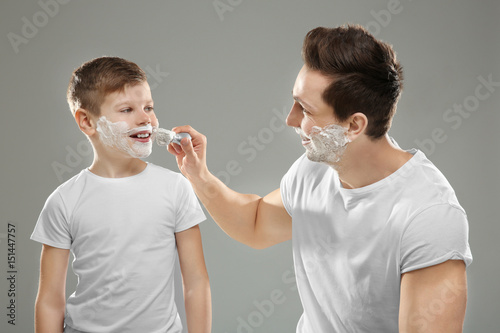 Father and son shaving on l...