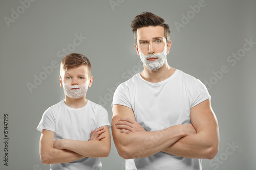 Father and son shaving on l...