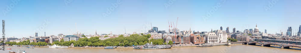 LONDON - MAY 2013: Beautiful panoramic view of city buildings along river Thames. London attracts 30 million tourists annually