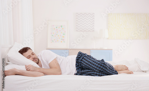 Man sleeping on two pillows...