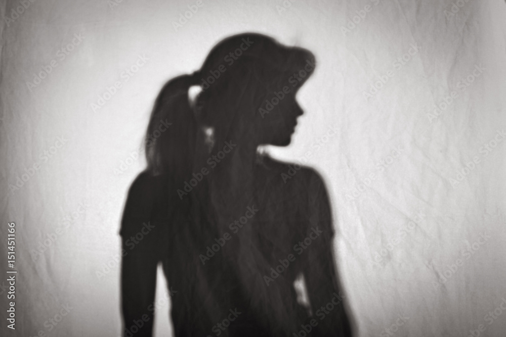 silhouette of woman profile on white texture