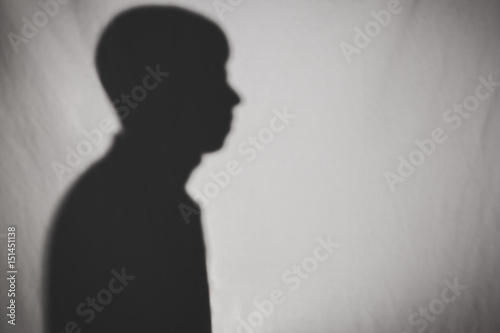 silhouette of man profile on white texture
