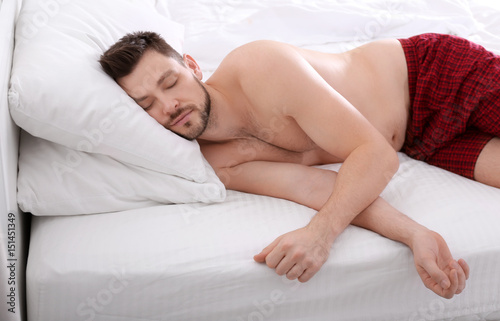 Man sleeping on two pillows...