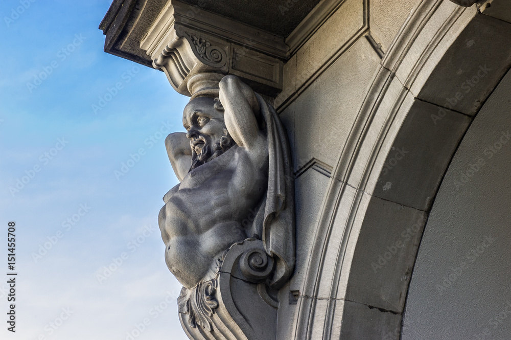 Obraz premium Atlas sculpture on a house facade in Zurich , Switzerland
