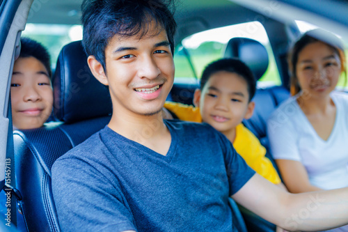 happy asian family with the trip in car