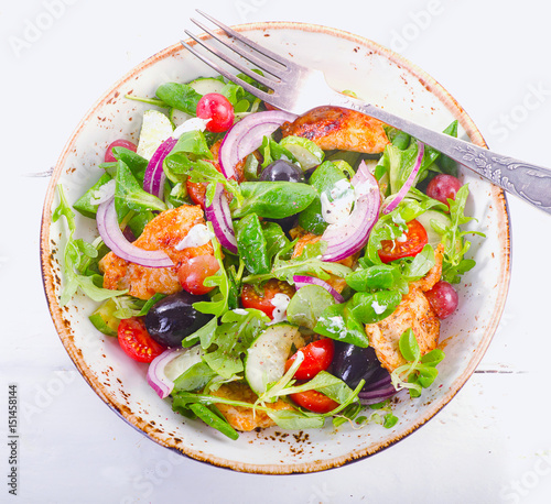 Fresh salad with chicken breast and vegetables. Healthy food.