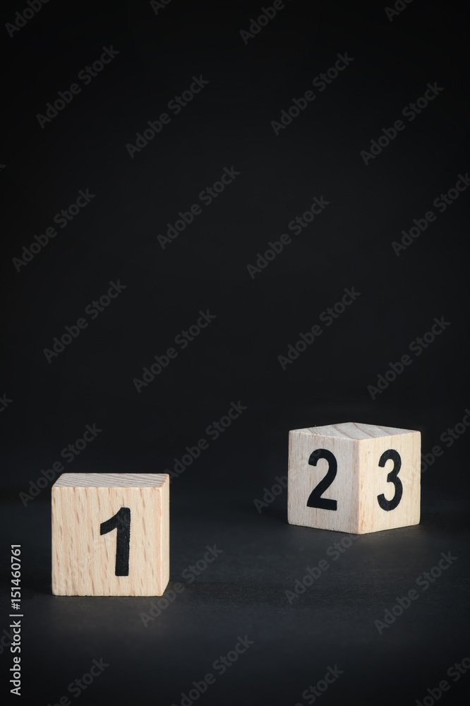 Business leader concept: wooden cubes 123 number on black background,competition idea Business leader concept: wooden cubes 123 number on black background,competition idea