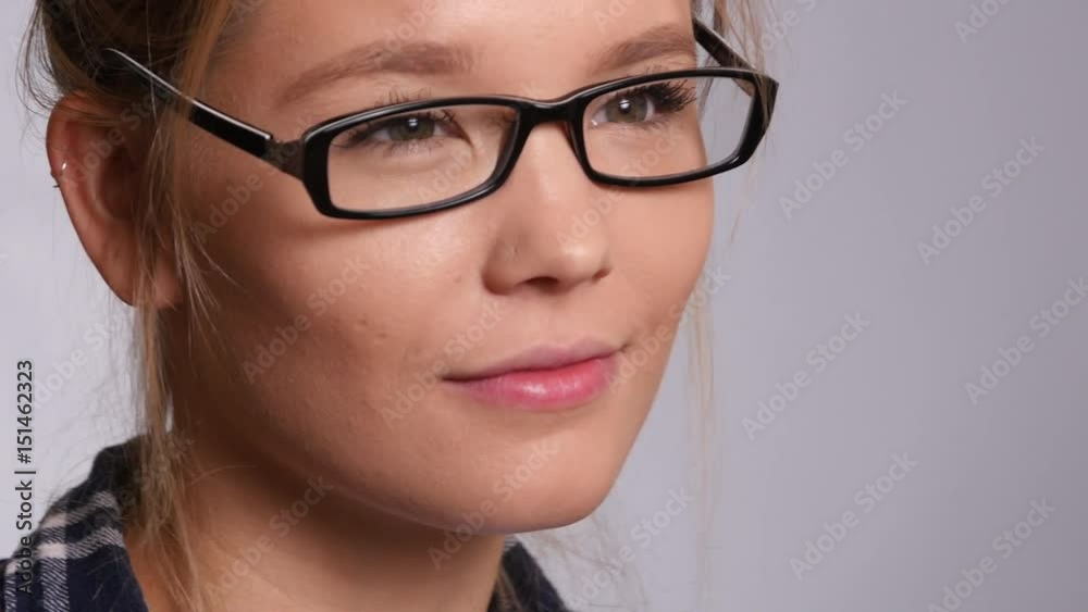 Closeup portriat of young woman on white background Closeup portriat of young woman on white background