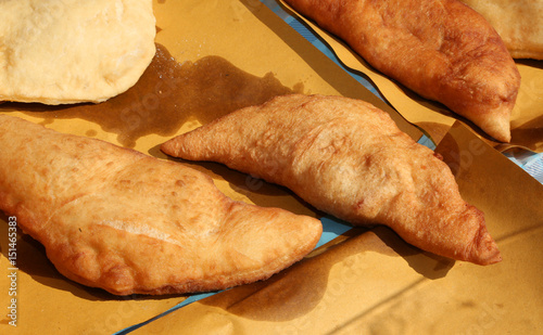 Big italian fried bread called Panzerotti or Pizza Puff photo
