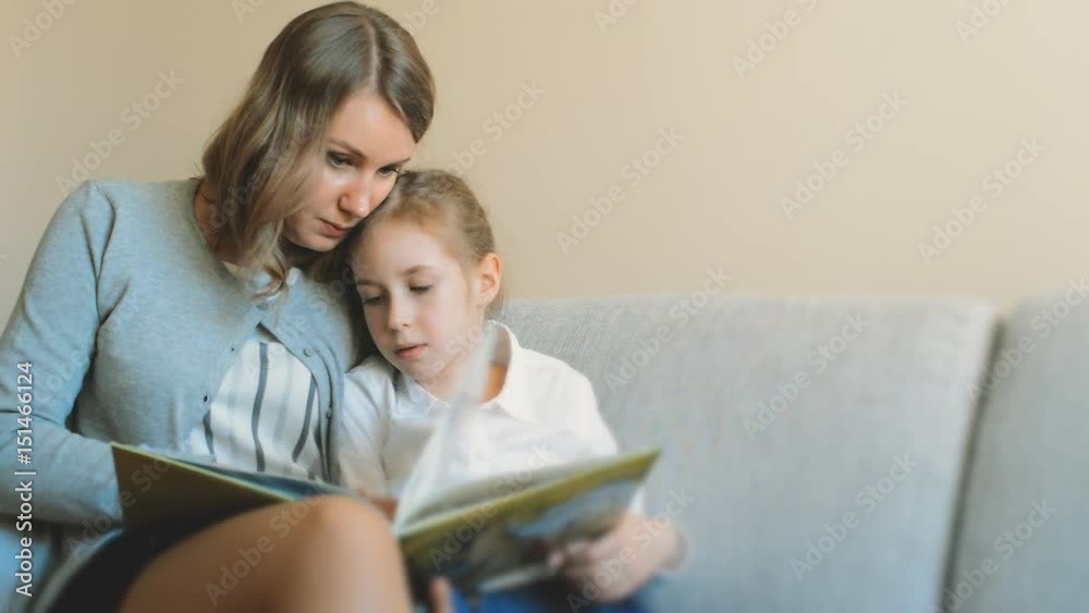 Mother and daughter reading a book. Mother and daughter reading a book.