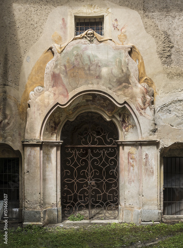 Door To a Crypt in an old Italian Church in Peglio, Italy photo