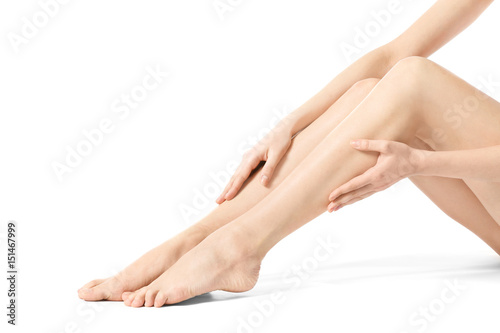 Fototapeta Naklejka Na Ścianę i Meble -  Legs of beautiful young woman on white background. Epilation concept