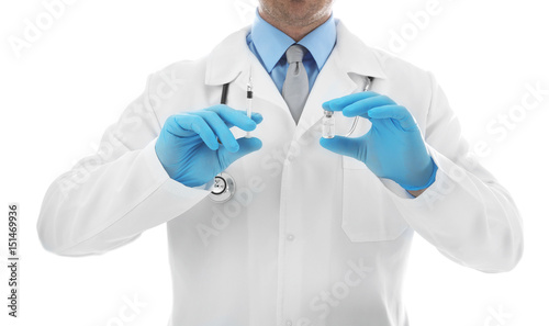 Doctor with syringe and medicine on white background, closeup
