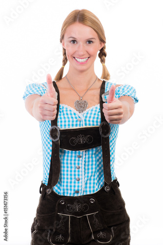 Vászonkép bayrisches mädchen in lederhosen zeigt daumen hoch