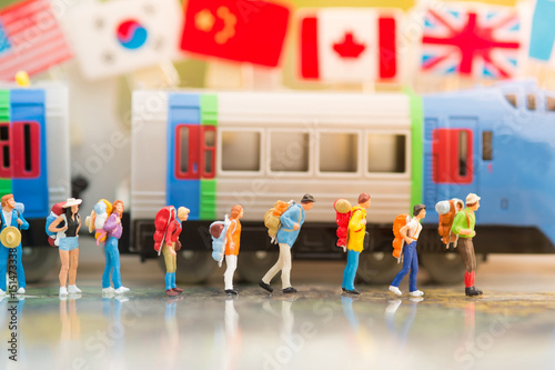 miniature people, backpack travel by train for travel. using as business background concept