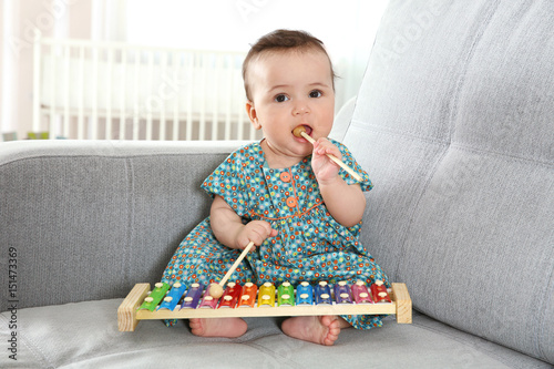 Cute little baby with xylop...