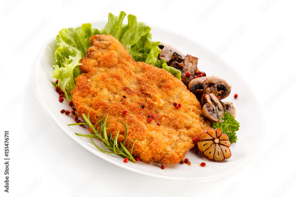 Fried pork chop with mushrooms on white background Fried pork chop with mushrooms on white background