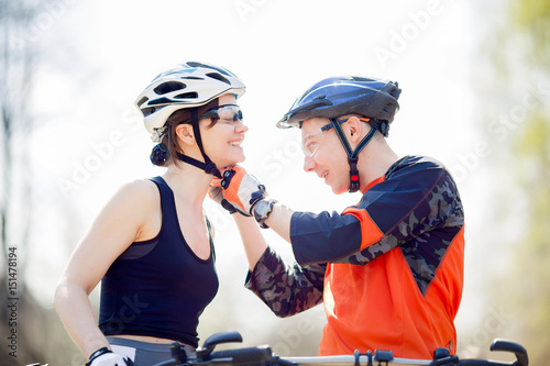 Fotografija Cyclists wear helmets in park