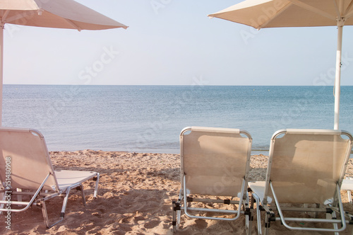 Lounge chairs and parasol on the beach