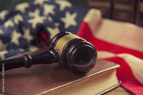 Wooden Gavel with American Flag on a wooden table