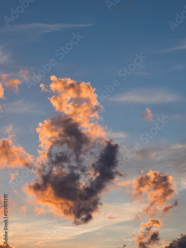 Clouds burning in evening sunlight