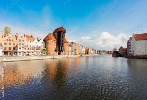 The Zuraw Crane and colorful gothic facades of the old town waterfront in Gdansk, Poland