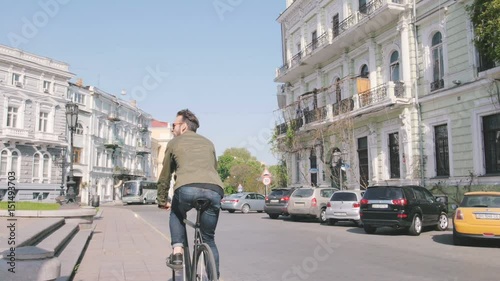 Wallpaper Mural Cyclist man riding fixed gear sport bike in sunny day on a city Torontodigital.ca
