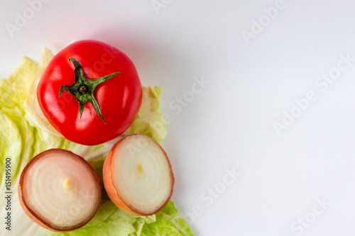 Tomato, cabbage, onion on the white background.. With place for inscription. Diet