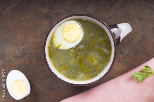 Soup of sorrel and young greens with egg